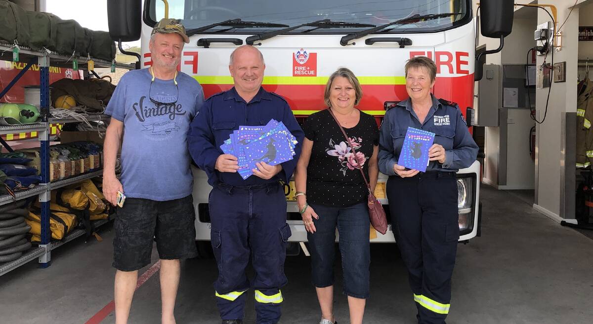 Mr and Mrs McCartney deliver special postcards from St John's Elementary School, Saint-Jean-Sur-Richelieu, Quebec, Canada, to Eden firefighters.