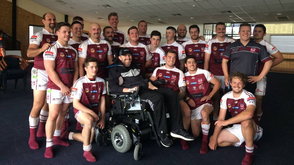 Paul Waite (in the wheelchair) and his 2018 Albion Park-oak Flats third grade side.