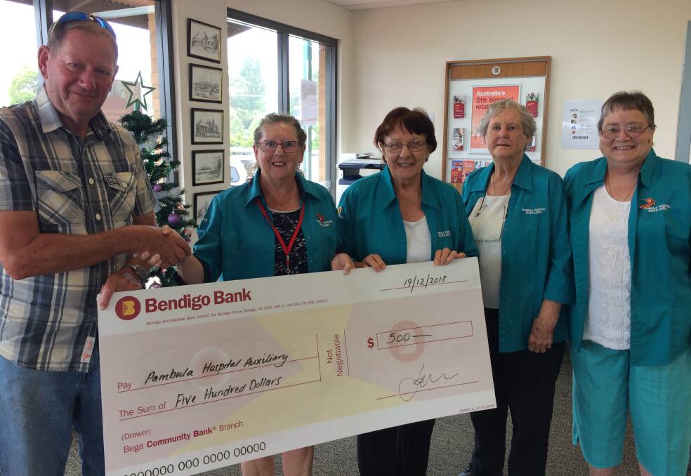 Generous: Gary Harvey presents a cheque to members of the Pambula District Hospital Auxiliary. Picture: Supplied.