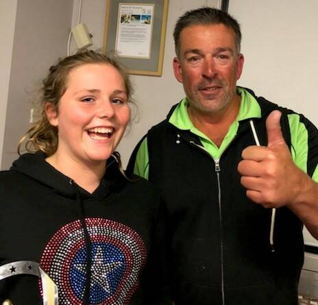 Pambula Nipper President Andrew Holt endorses Maggie Bourke's selection as the club's Nipperette of The Year at the presentation night.