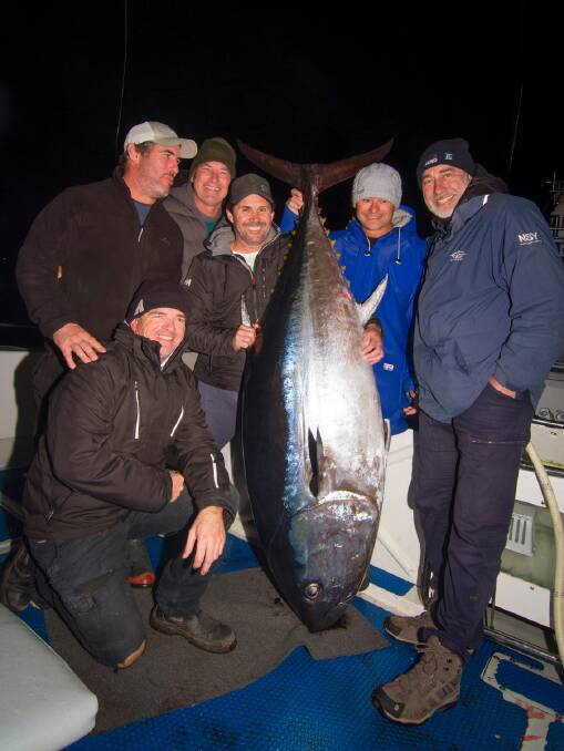 Solid: Customers of Charter Fish Narooma stoked after landing a 148kg bluefin on Monday. Image: Georgia Poyner.