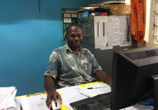 Deputy principal Kenneth Ephram at Tebakor College in Port Vila, Vanuatu happy to have his own computer donated to him by Bega Valley Computers in Pambula.