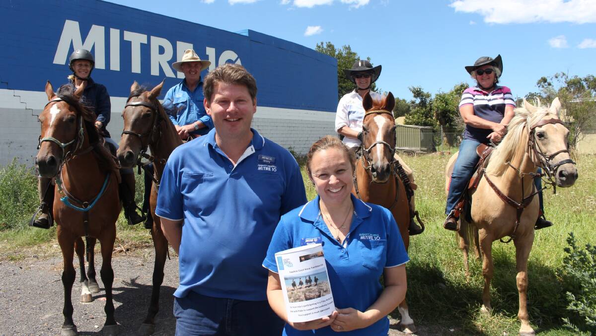 Mitre 10 employee Tennille Schaefer and store manager Jeremy Schrieber with Sapphire Coast Horse Trail Riders.