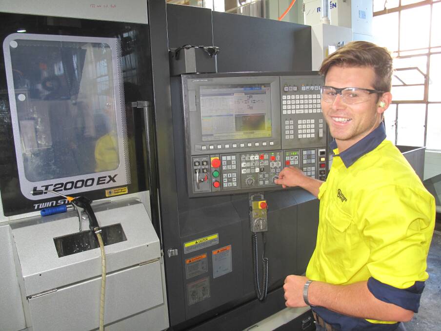 Inspiring: Graduate materials engineer Rowan Caldwell at work on a machine at Lithgow Small Arms Factory. Picture: Supplied.