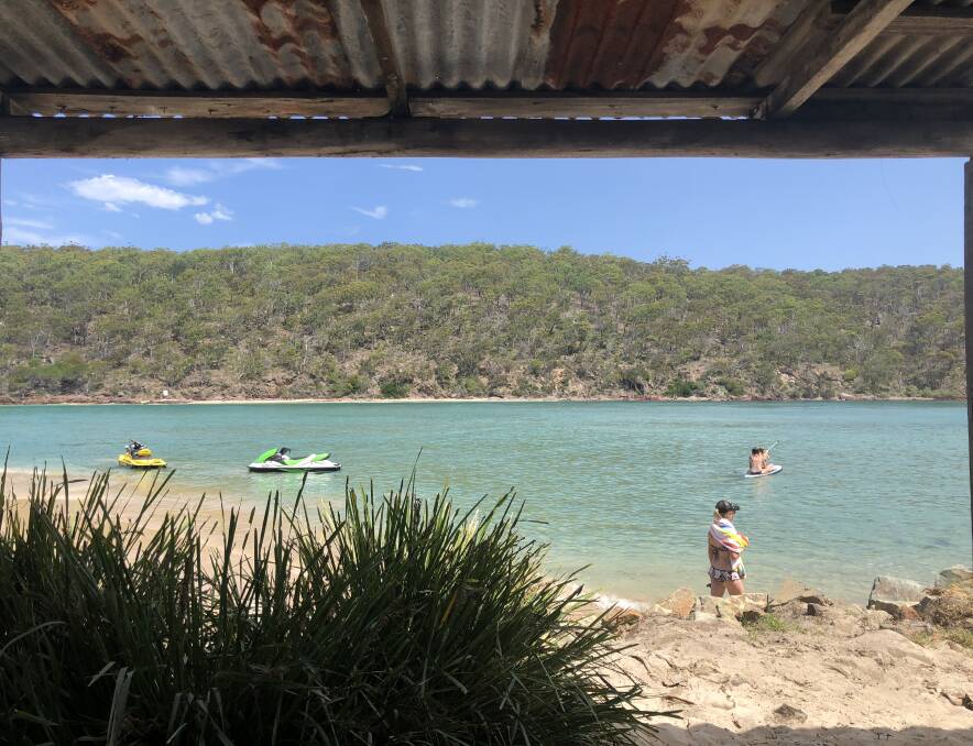 Seeking shade: The Pambula river mouth was a beautiful oasis on Sunday, everyone enjoyed the crystal clear water. Photo: Claudia Ferguson