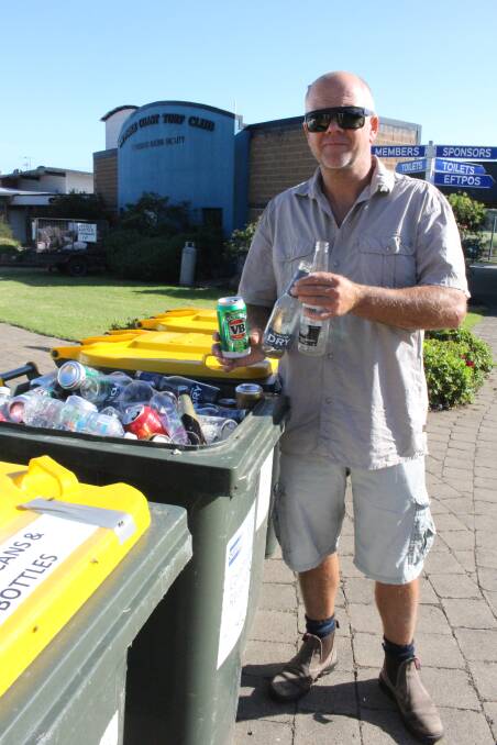 Packed to the brim: Rob Tweedie with some of the recycling up for grabs at the Turf Club.