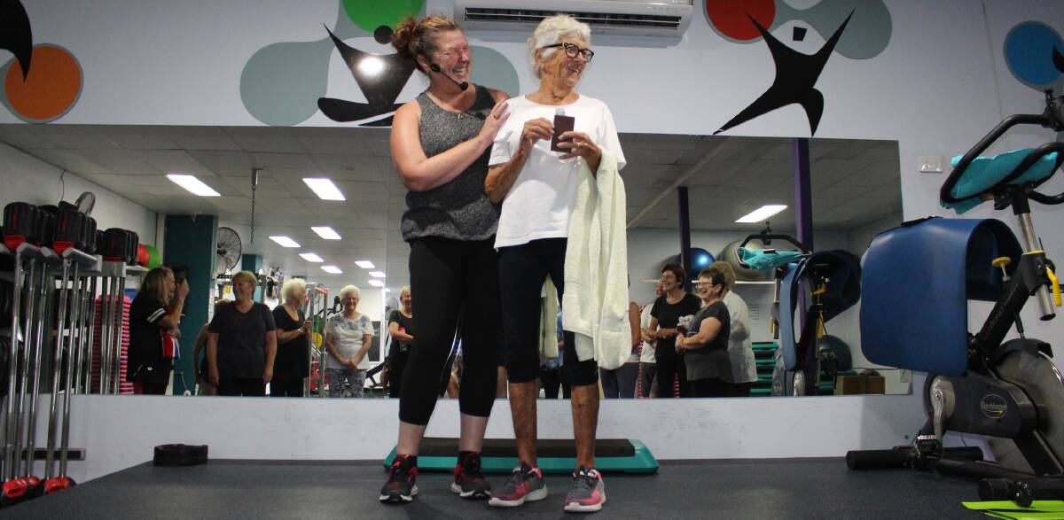 Gordana Raek awarding Ruth Clarke a life membership after a gym class.