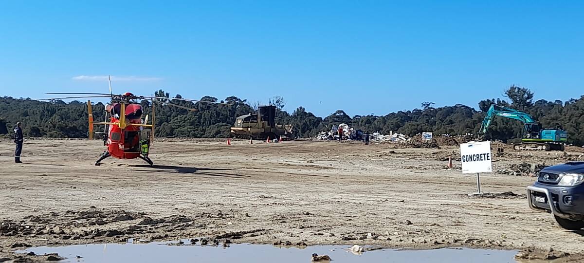 The Westpac Life Saver Rescue Helicopter crew respond to an emergency distress signal at the Surf Beach Waste Management Facility on Tuesday, after a discarded beacon inadvertently activated within the tip face.