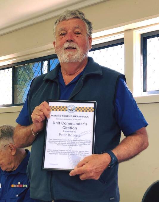 JOB WELL DONE: Marine Rescue Merimbula volunteer Peter Roberts receives the Unit Commander's Citation for his 14 years' commitment to the service.