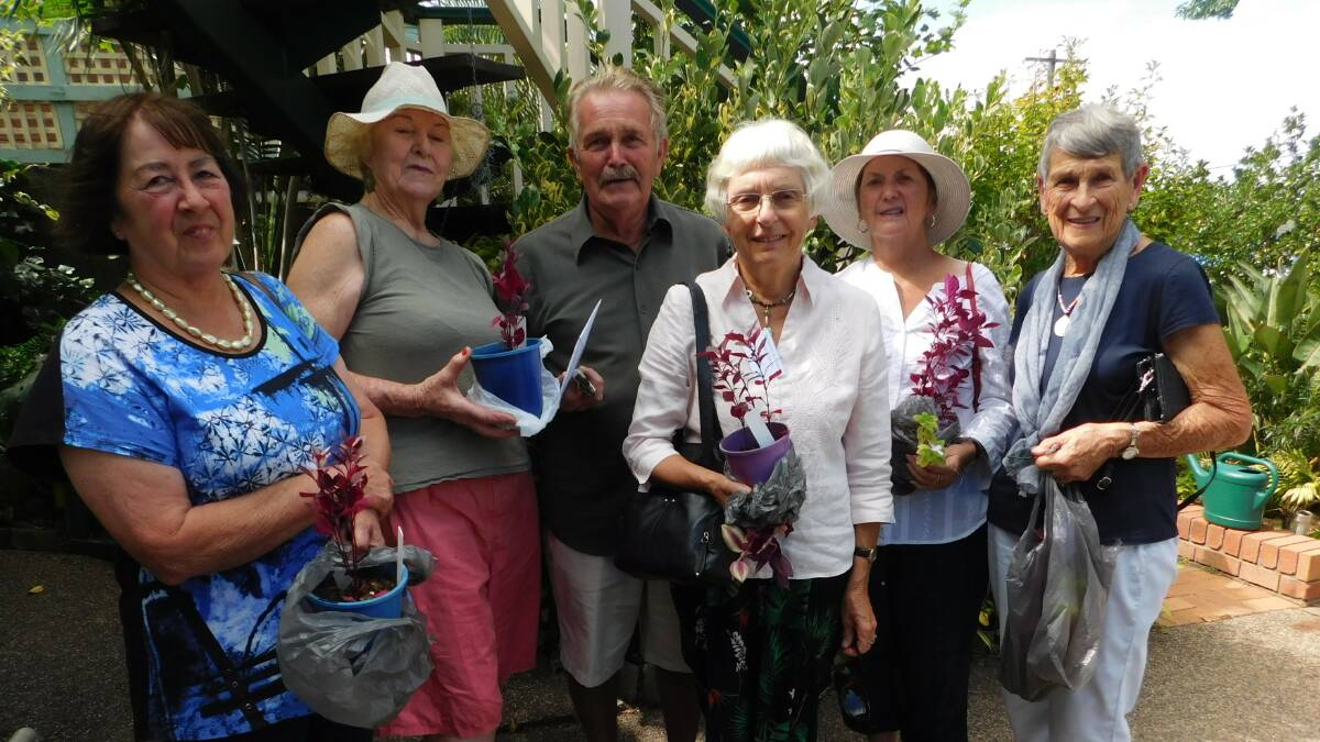 Merimbula Garden Club members enjoy a recent visit to Des Whitby's Pambula garden.