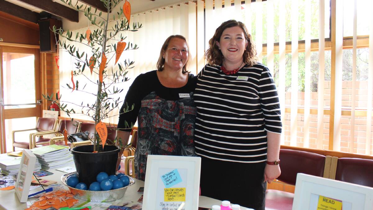Social tree: Michelle Canbulet of Uniting Home and Community Centre and Beck Minear of Uniting Ability Links at Merimbula's lunch at the Uniting Church Hall on Monday. Photo: Claudia Ferguson
