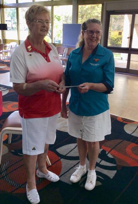 Eden ladies' bowls president Jan Pyke proudly presents Shirley Rixon of Pambula District Hospital Auxiliary with the fundraising cheque.