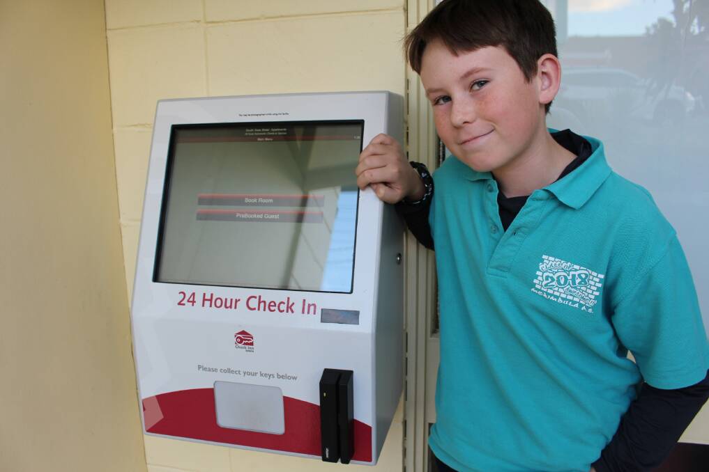 Room please: Hugh Christian testing South Seas Motel's new 24-hour check-in machine. Photo: Claudia Ferguson