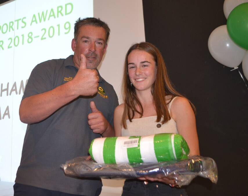 Andrew Holt presents the director of surf sports award to Narooma's Elli Beecham, Branch Competitor of the Year.