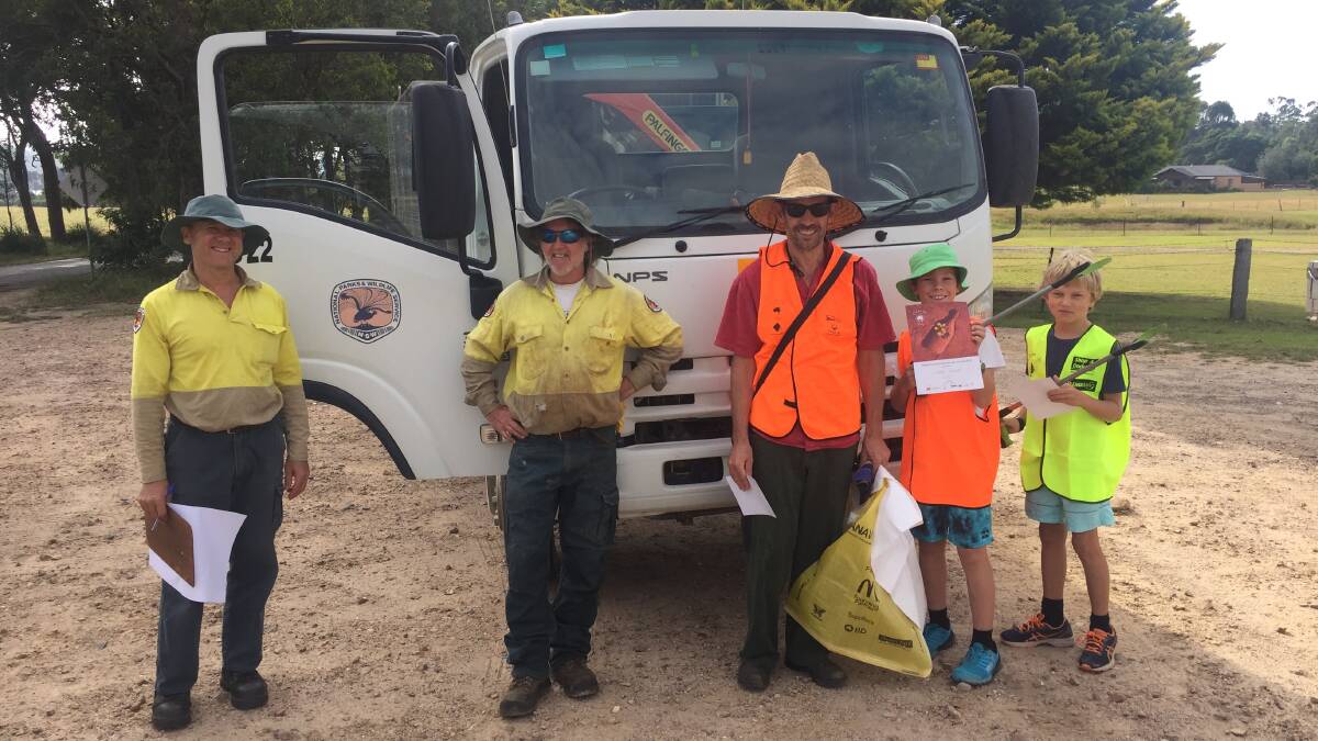 Clean up crew: Grant Brewer and Darryl Bills of NPWS, Peter and Harry Haggar of Brogo and Tanna Waterson of Bournda headed to Sapphire Coast Drive.