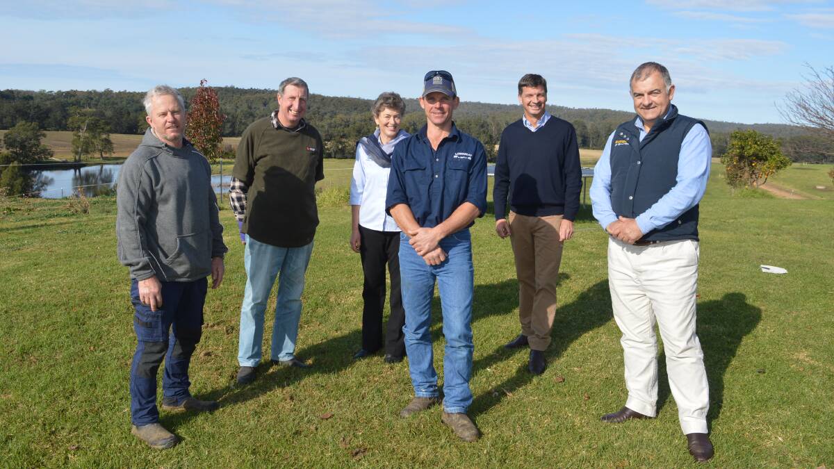 Bodalla dairy farmers Darren Parrish and Mark Bice with Liberal candidate Fiona Kotvojs, dairy farmer Matt Broad, Minister for Energy Angus Taylor and Nationals candidate Trevor Hicks at the Broad family dairy farm, Bodalla on Monday, June 22.