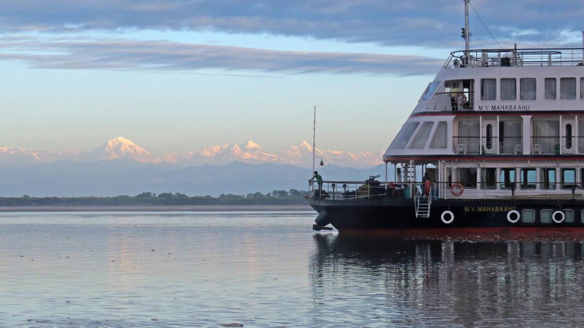 MV Mahabaahu on the Brahmaputra River … soaring Himalayas in the background. 