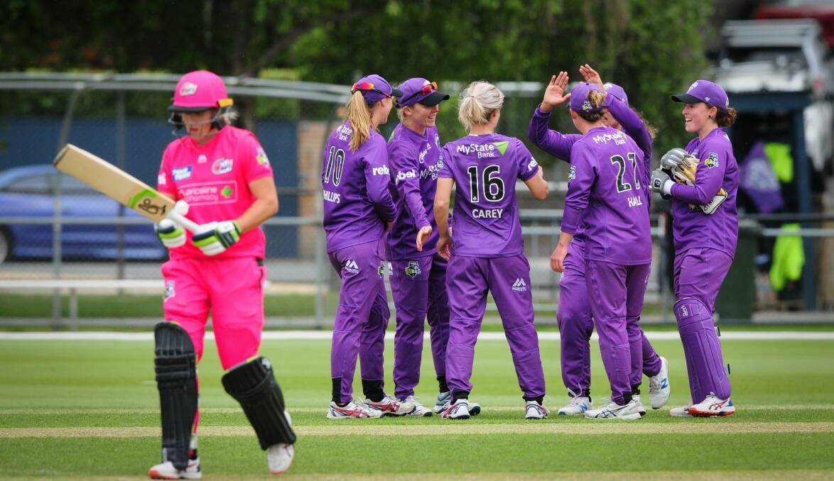 TERRIBLE TIME SLOT: The Hurricanes celebrate the wicket of Sydney Sixers' Alyssa Healy at Invermay Park on Wednesday. Picture: Paul Scambler.