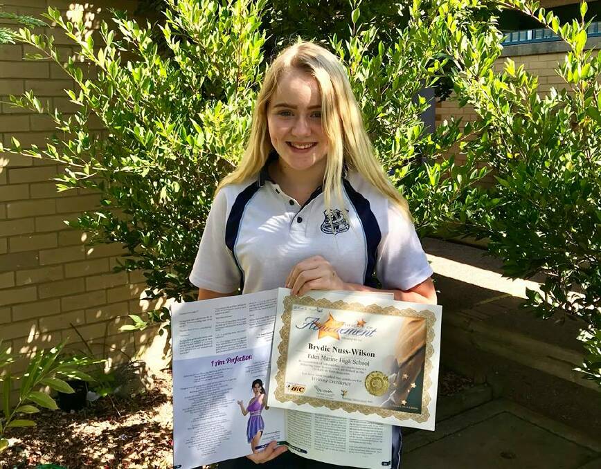 PUBLISHED POETRY: Brydie Nuss-Wilson displays her certificate of achievement and the Oz Kids in Print publication where her poem 'I Am Perfection' appears. Picture: Jasmine Lefel