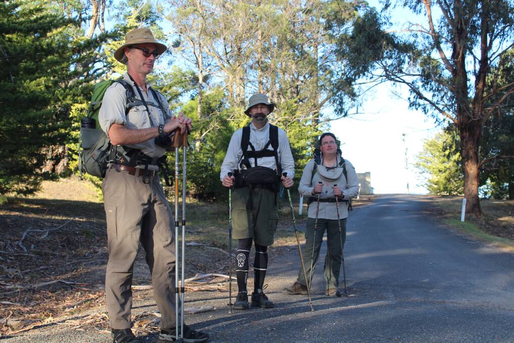 PILGRIMAGE: Sean Deany, David Schutz and Josh Martin set off from the St Peter's Catholic Church in Pambula on their way to Merimbula on Tuesday, April 17. 