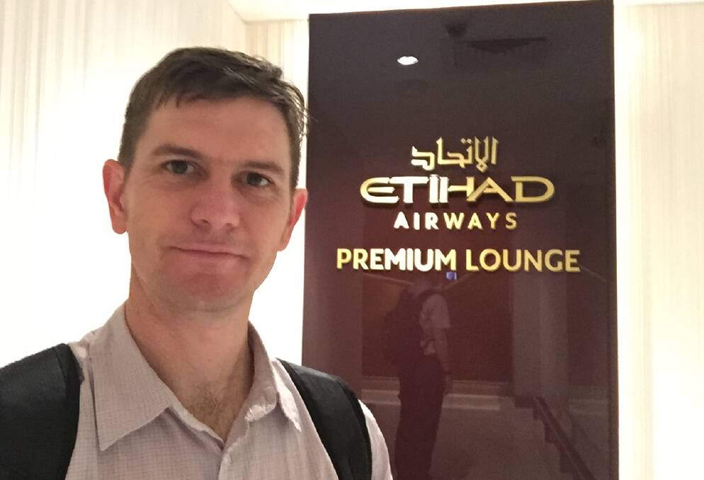 ENTER: Outside the Etihad Airways business lounge, ready to re-charge and regret sampling an Arabic coffee. 