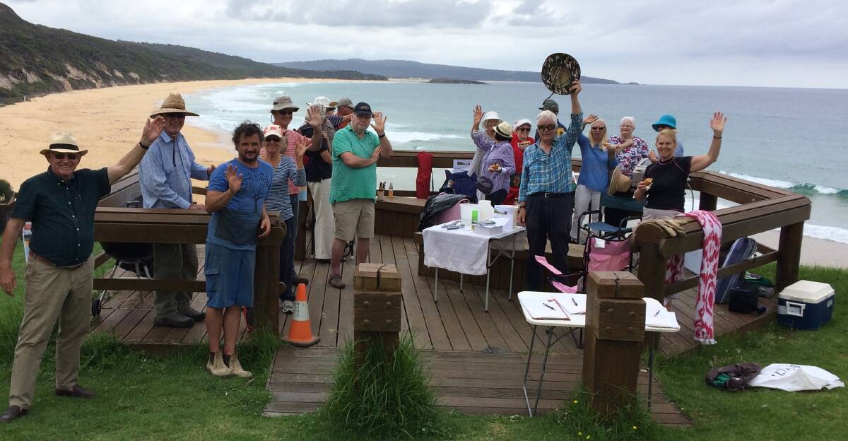 North Tura Beach Residents Association members enjoy a barbecue after the working bee that provoked a council press release.
