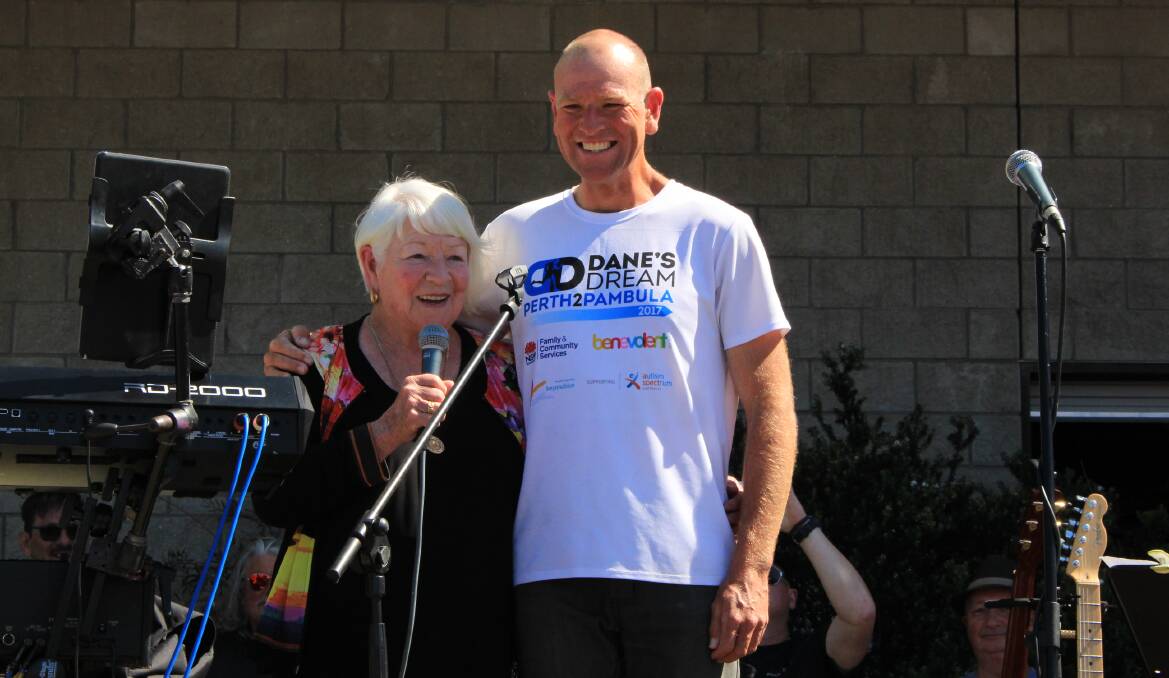 TEAMWORK: A proud moment for Junee Waites as she speaks to the huge crowd who gathered to welcome son Dane Waites after his 4000km run from Perth to Pambula. 