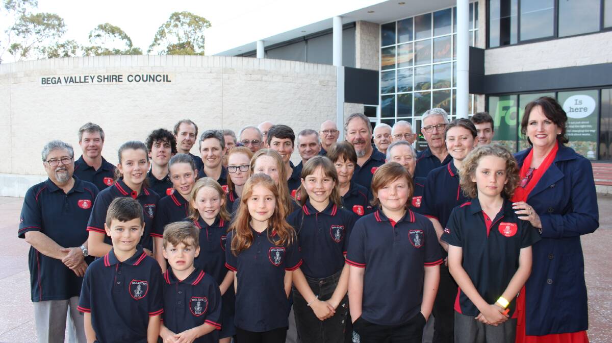 Members of the Bega District and Bega All Ages Development Band with conductor Candy McVeity prior to performing at the Civic Centre on Saturday evening.
