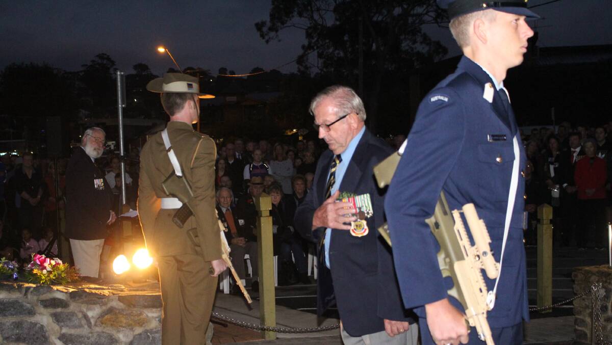 Tony Toussaint lays a wreath at last year's Anzac Day dawn service.