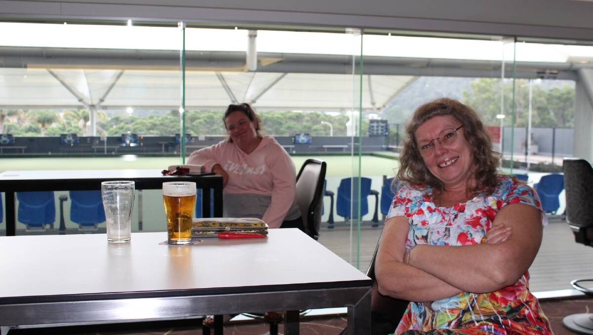 Suitably distanced but enjoying a beer and a chat, Suzanne Sertori and Jodie McCormack of Merimbula.