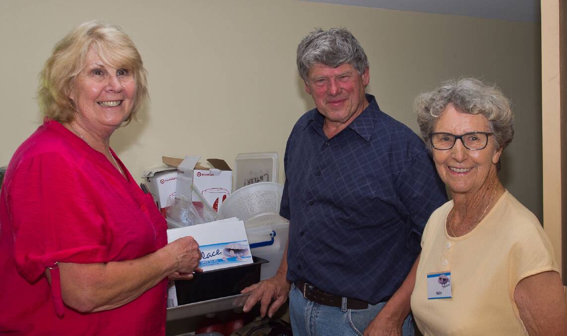 BOWLERS DONATION: Pearls Place volunteers Gail Eivers (left) and Win Phillips with Alan Brown, president of the Tura Beach Indoor Bowling Club.