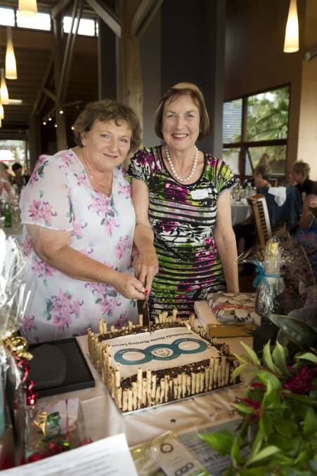 LONG SERVICE: Merimbula Home Nursing Service founders Cheryl Chaplin and Ruth Hay cut the cake to celebrate 20 years of the service in December 2017.