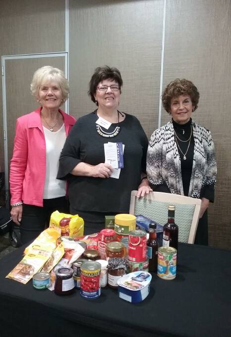 View Club members Shirley Seychell and Myriam Rigley with Christine Welsh, centre, with donations from View Club members to the Sapphire Community Pantry.