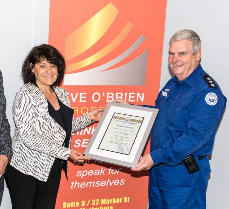 Generosity recognised: Merimbula Marine Rescue unit commander Bill Blakeman presenting Eve O’Brien with a certificate of appreciation.