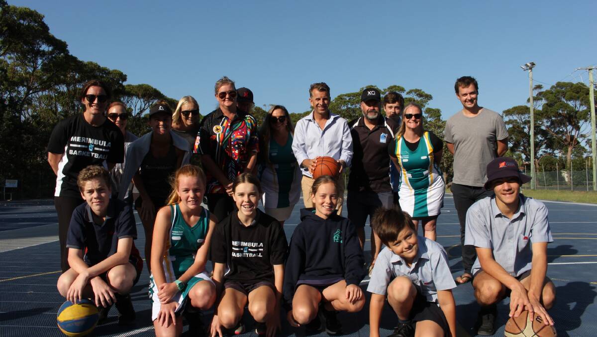 Basketball and netball players with member for Bega Andrew Constance at the time of the funding announcement in 2019.