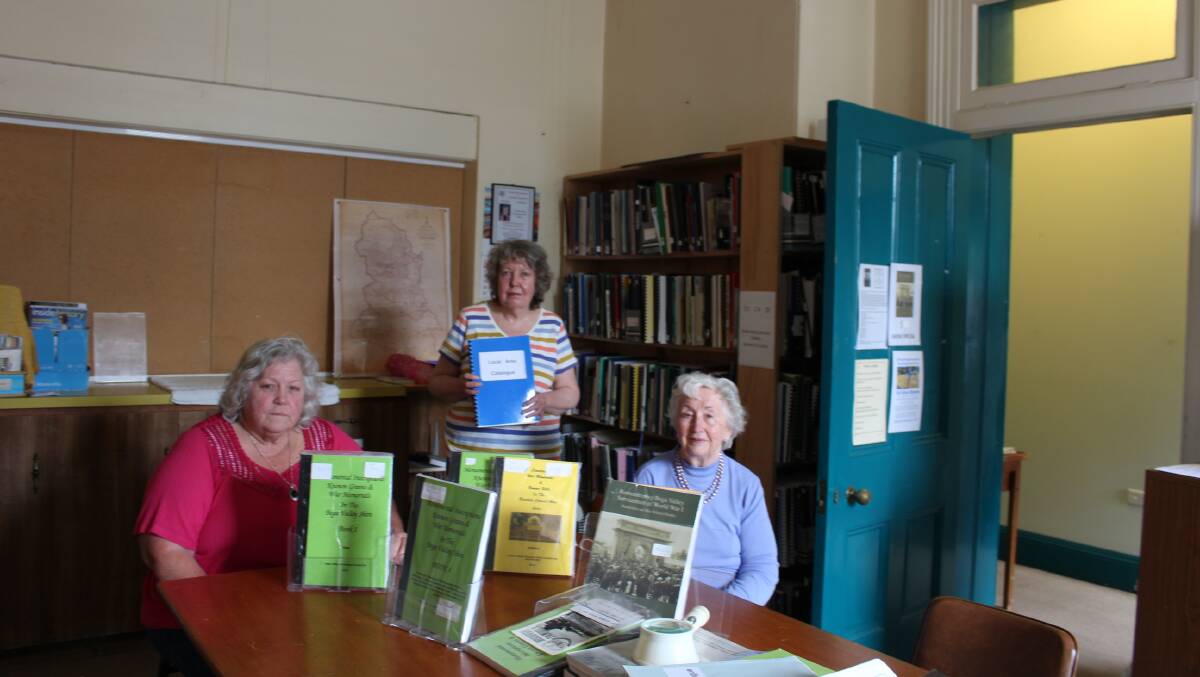 Genealogy Society president Liz McIntyre, treasurer Joan Brown and librarian Ursula Hunt at Pambula Courthouse.