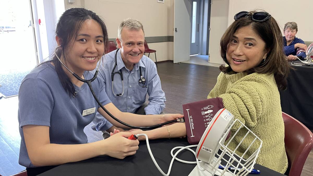 ANU medical student Vanessa Yiu with Dr Duncan MacKinnon, of Bega Valley Medical Practice and Josephine Quintero of Melbourne who took the opportunity to have her blood pressure checked while holidaying in Merimbula in October 2022. Picture by Denise Dion