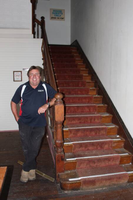 Neil Rankin next to the original staircase in the Hotel Australasia.