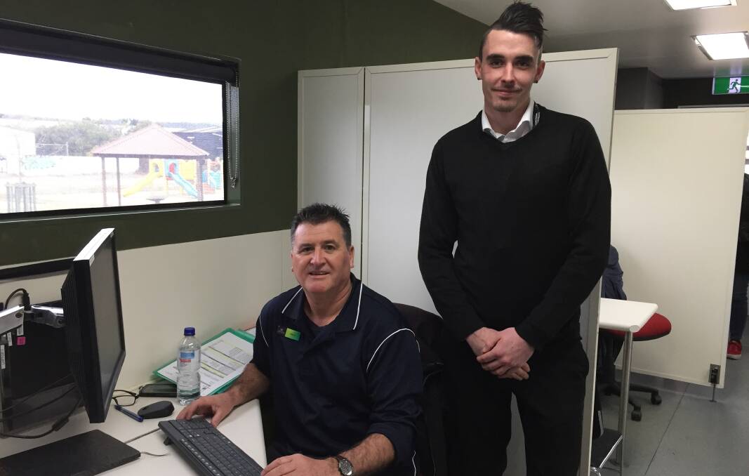 Golden Wattle mobile service centre manager Andrew Gregory and service officer Oli Bennett.