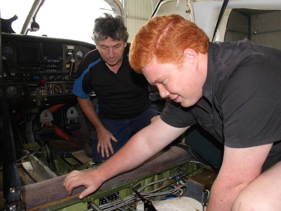 Rex Koerbin of Merimbula Aircraft Maintenance and apprentice Tom Burn.