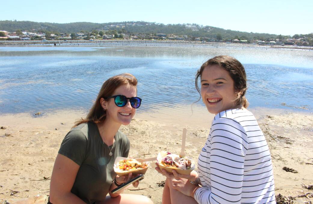 The perfect spot: Lulu O'Brien, of Canberra and Allyse Ayling, of Merimbula found a spot away from crowds to enjoy their taste of EAT Merimbula.  