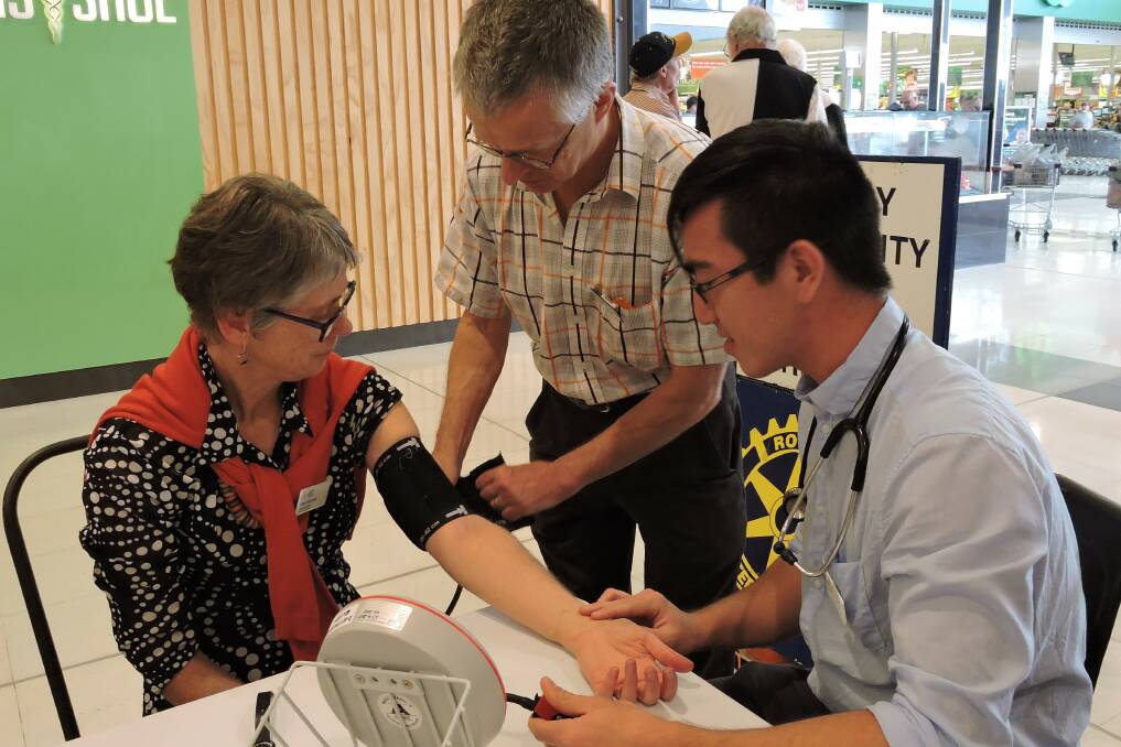 Dr Andy Piotrowski supervises community blood pressure screening in Bega. 