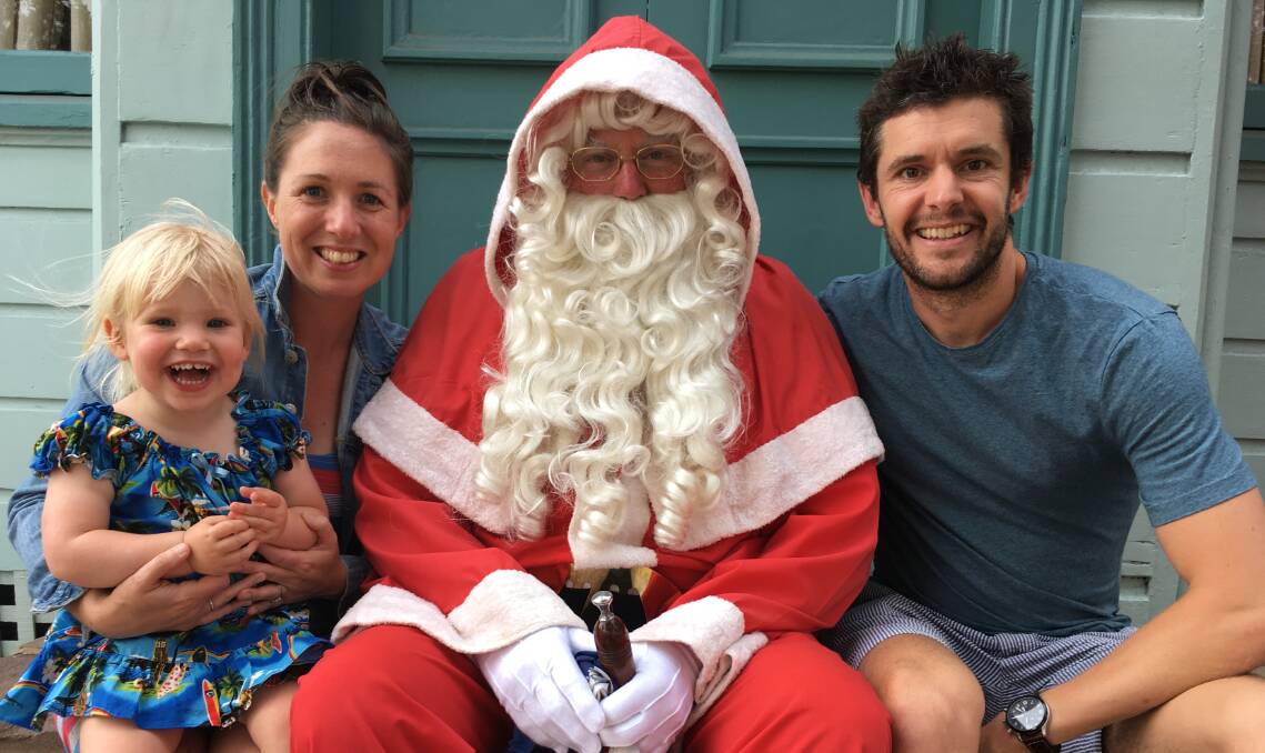 Melbourne family, Eliza and Mark Daniel and daughter Zoe managed to have an early chat with Santa who will be reappearing at the Pambula Christmas shopping night.
