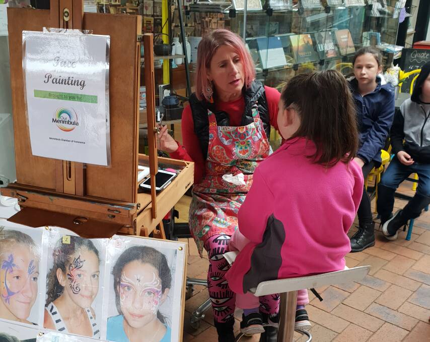 SueEllen Yates had a queue of customers for face painting.