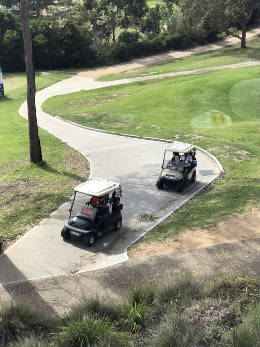 Golfers out for a game at Tura Beach Country Club, but with just one person in a cart.