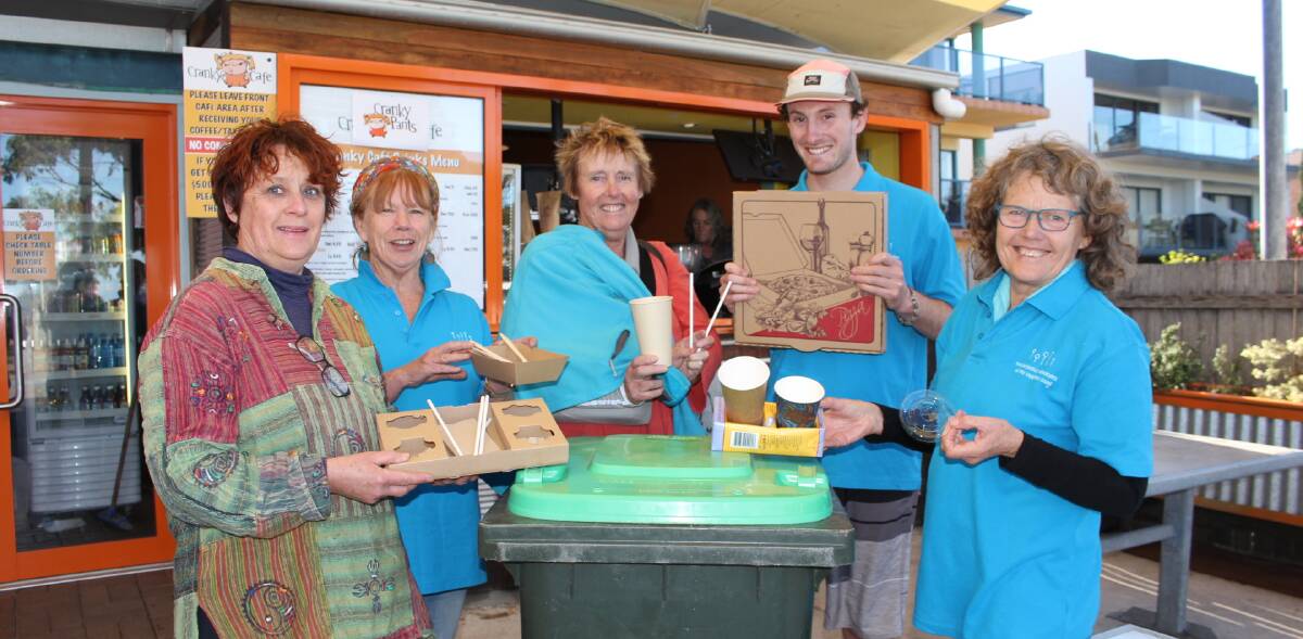 Lee James of Cranky Cafe with Social Justice Advocates Sue McGee, Wendy Wait, Toby Jennings and Ann Wykes and some items for the FOGO bin (but not the coffee cup tray made from a milk carton).