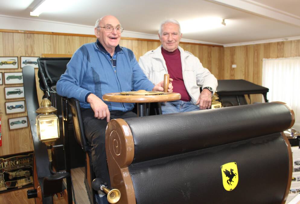 Making history: Replica historic car builder Don Langley with Sapphire Coast Historic Vehicle Club president Alex McQueen in the replica of the first ever 1898 Porsche. 