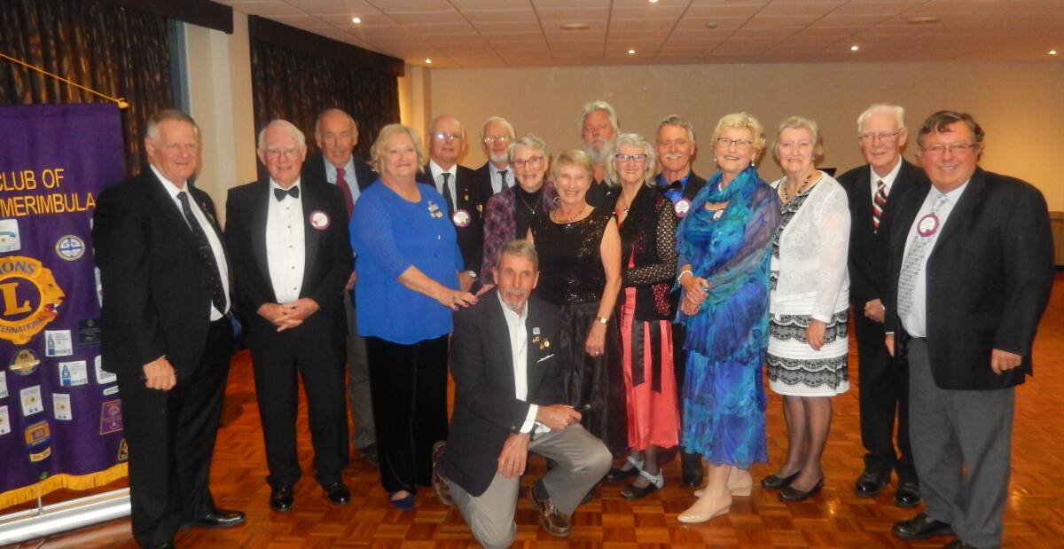 CHANGEOVER: The incoming board of the Pambula Merimbula Lions Club with president Phil Hall kneeling in front.