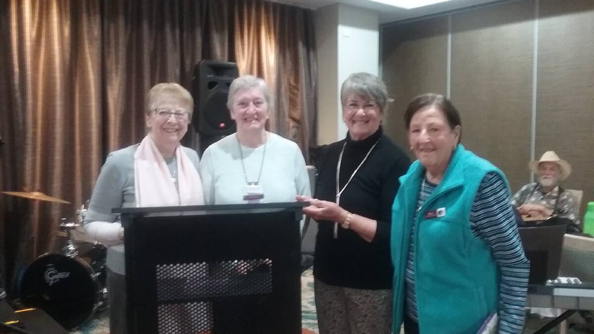 Merimbula Day View president Danielle Watkins, zone councillor Valerie Hobbs, and new members Rosemary Searles and Marie Lucas receiving their badges.