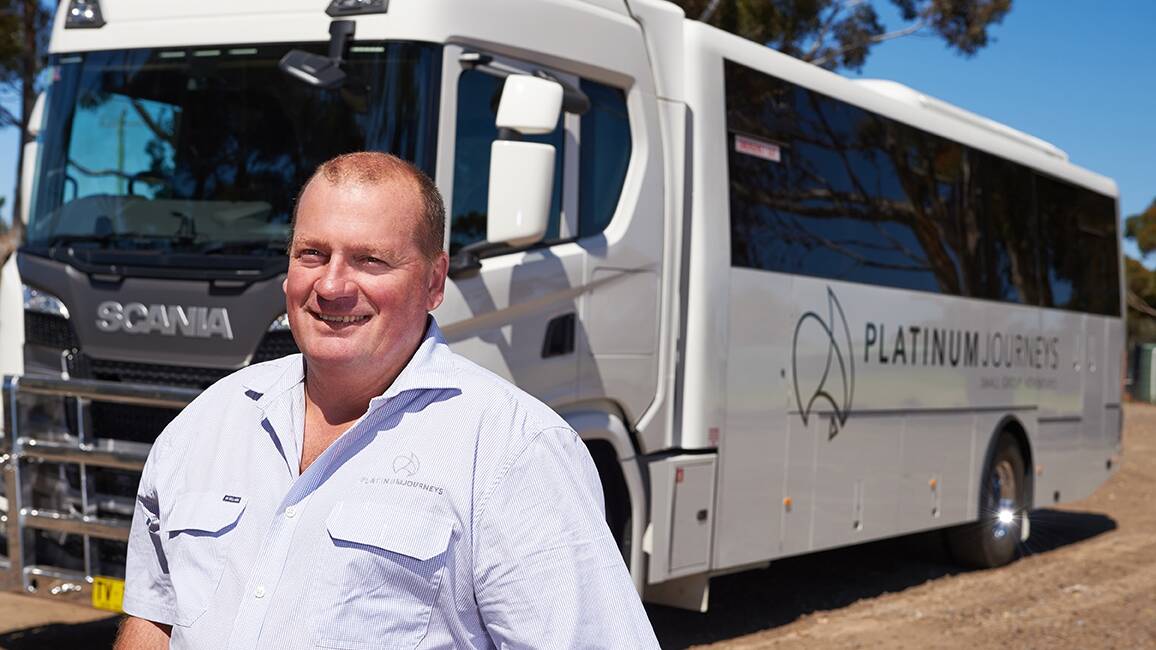 Paul Pincini in front of one of his new all-terrain touring buses. 